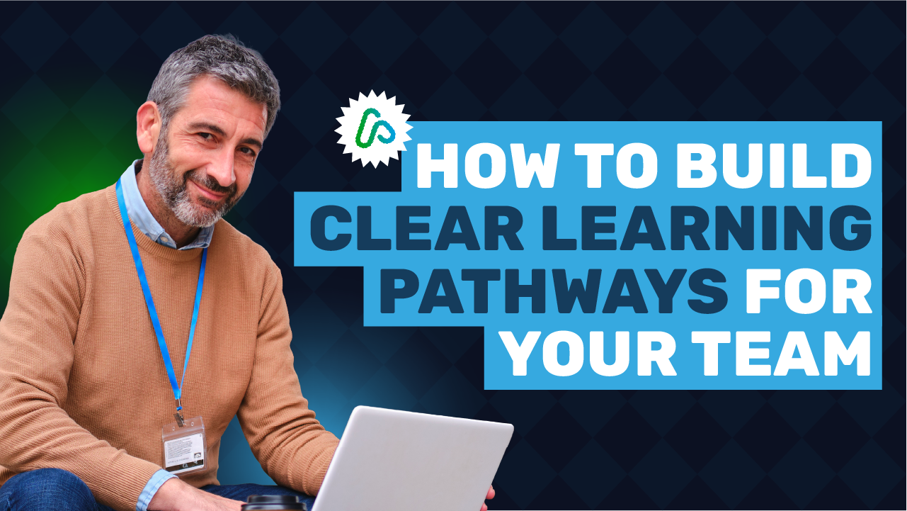 Aspire360 Blog header image showing a grey haired Middle Aged man using a laptop at work, with the blog title "How to build clear learning pathways for your team"